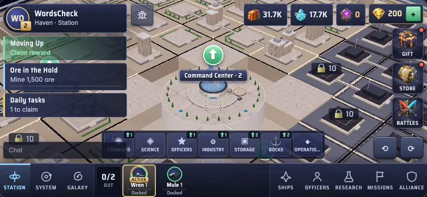 The station view: the Command Center at level 2 in the middle of a grid of building plots, with locked districts to the right and the district buttons along the bottom.